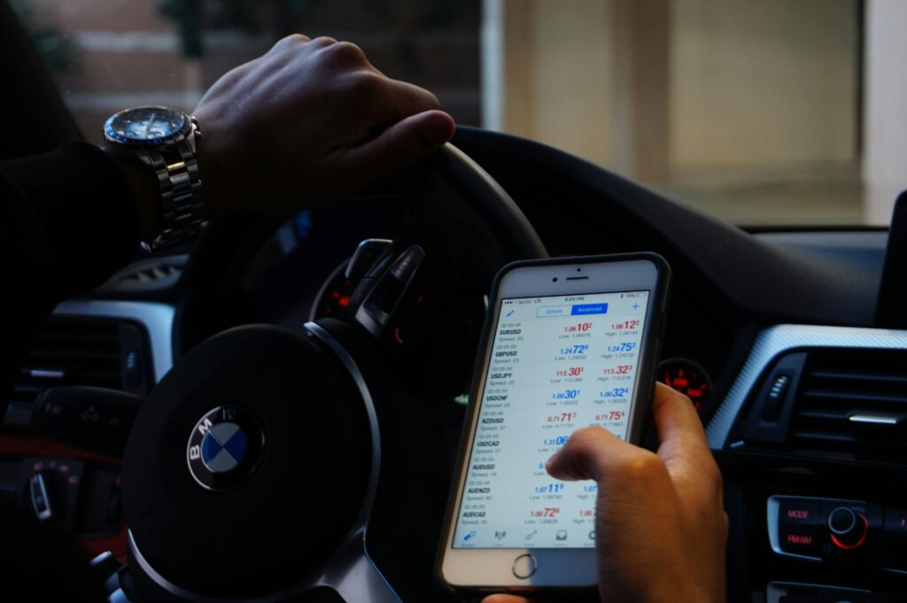 Person checking real-time exchange rates on a currency exchange calculator app