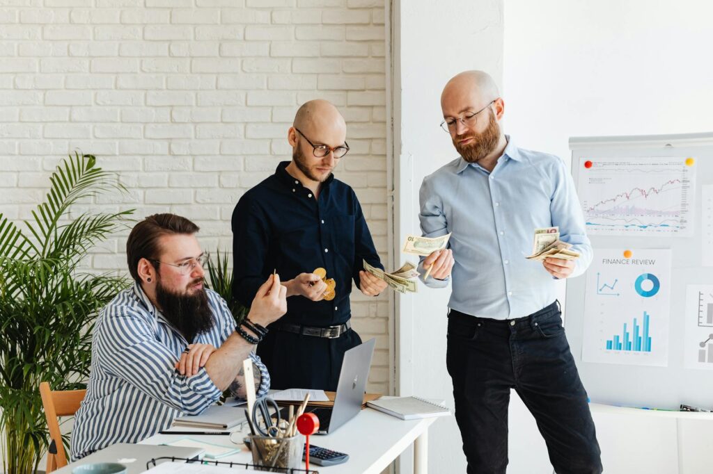 A visual representation of a startup managing finances, showing charts, graphs, and a business expense calculator interface, symbolizing smart startup budgeting.